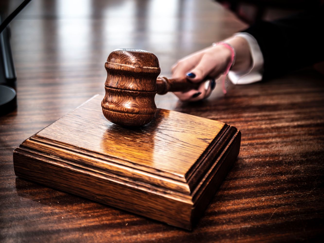 Gavel resting on a wooden sound block, representing the need for a specialized copyright mediator