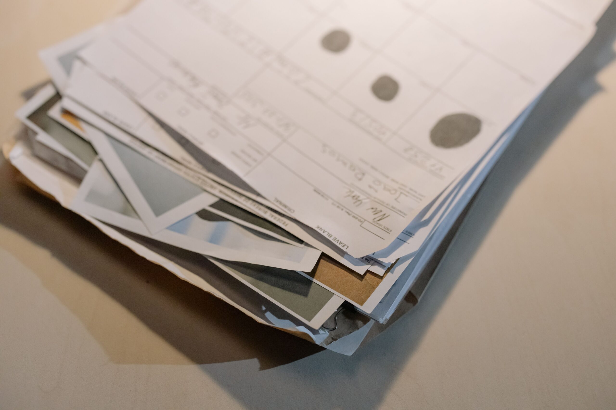 Stack of documents representing discovery costs and records in business contract litigation