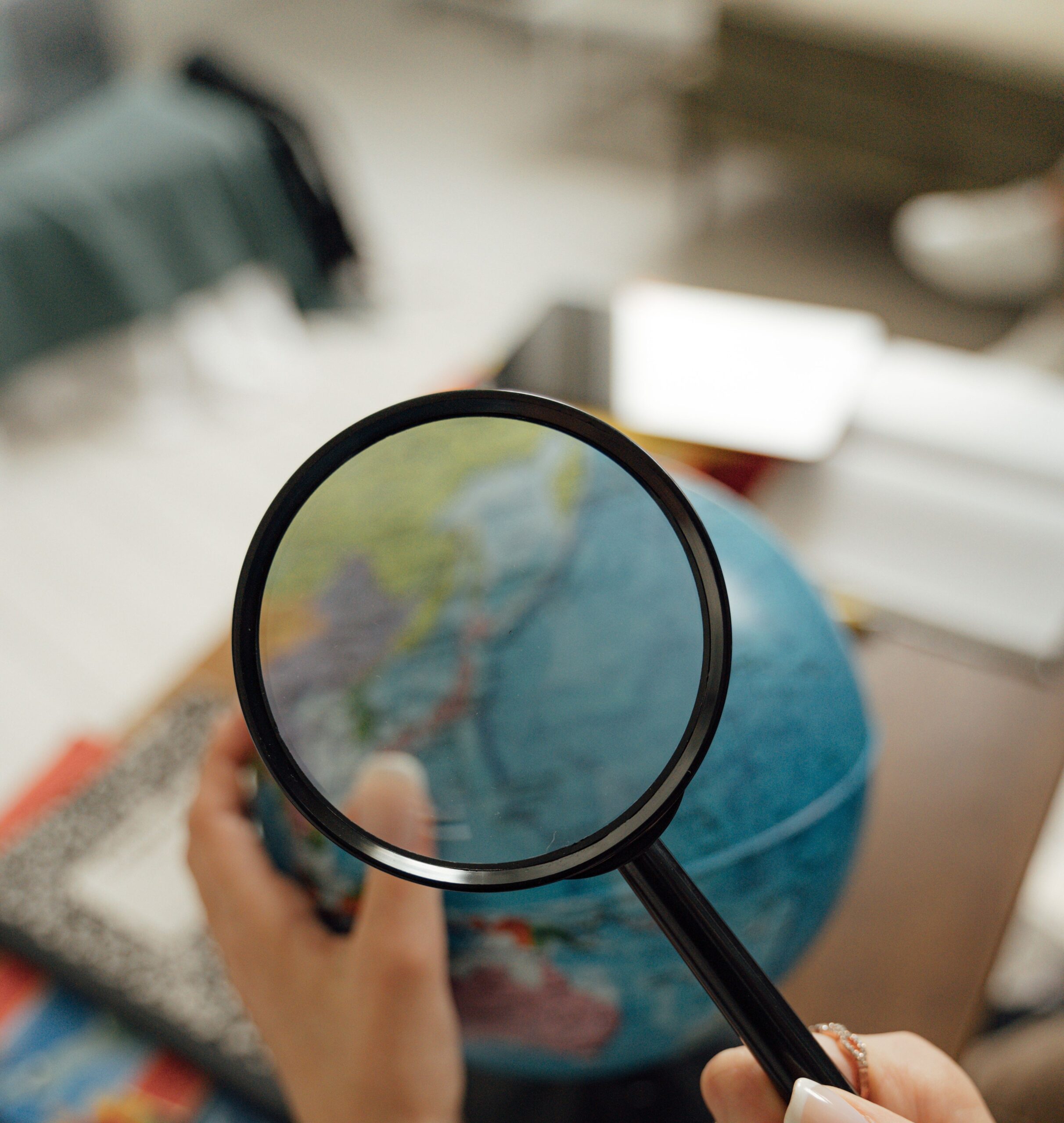 Magnifying glass examining fine detail, representing the technical complexity of trade secret disputes